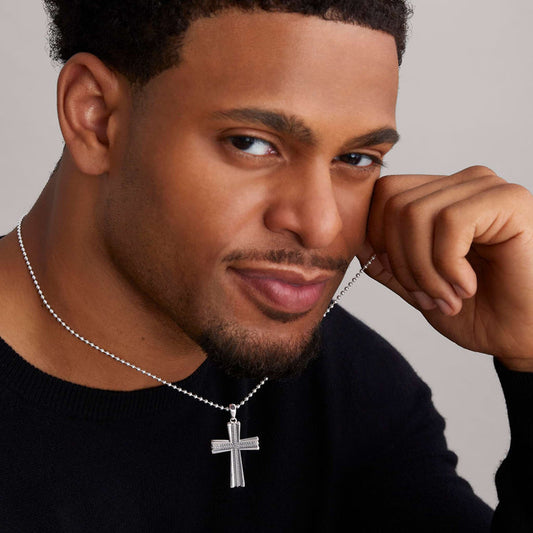Sterling silver cross pendant necklace.