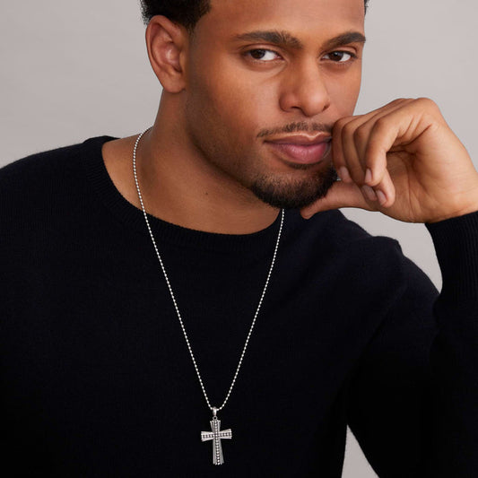 Sterling silver cross pendant necklace.