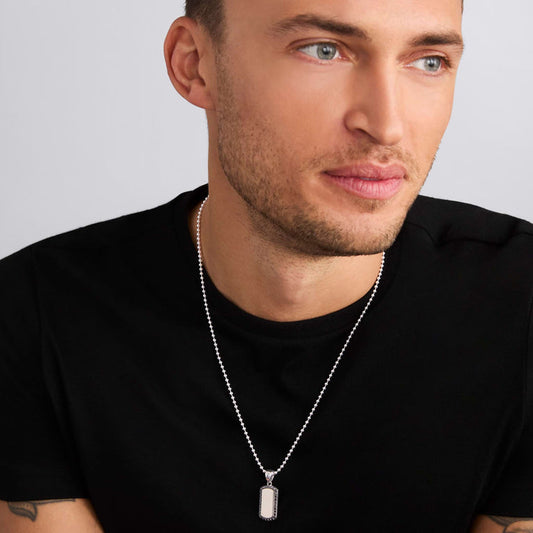 Sterling silver pendant necklace on model.