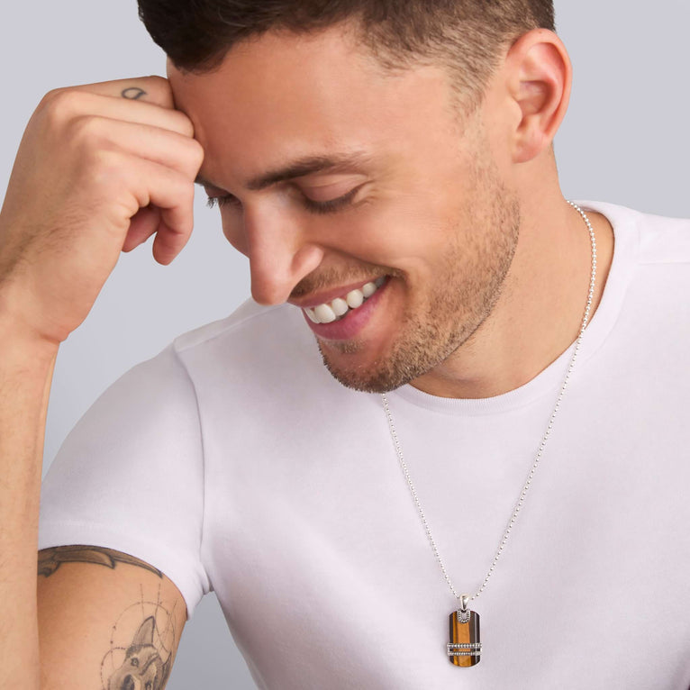 Rectangular tiger eye pendant in sterling silver.