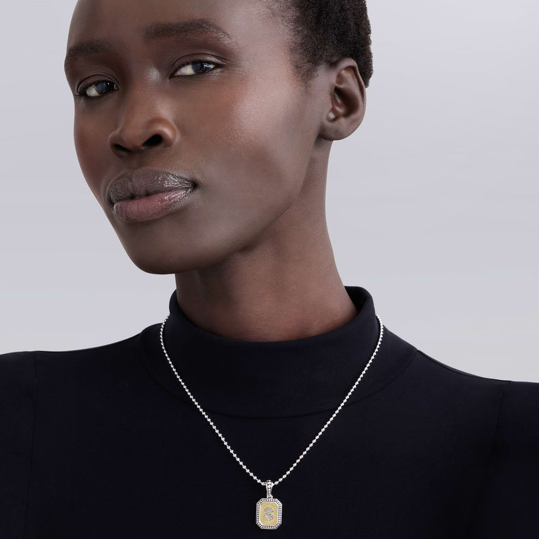 Sterling silver necklace with diamond accents.