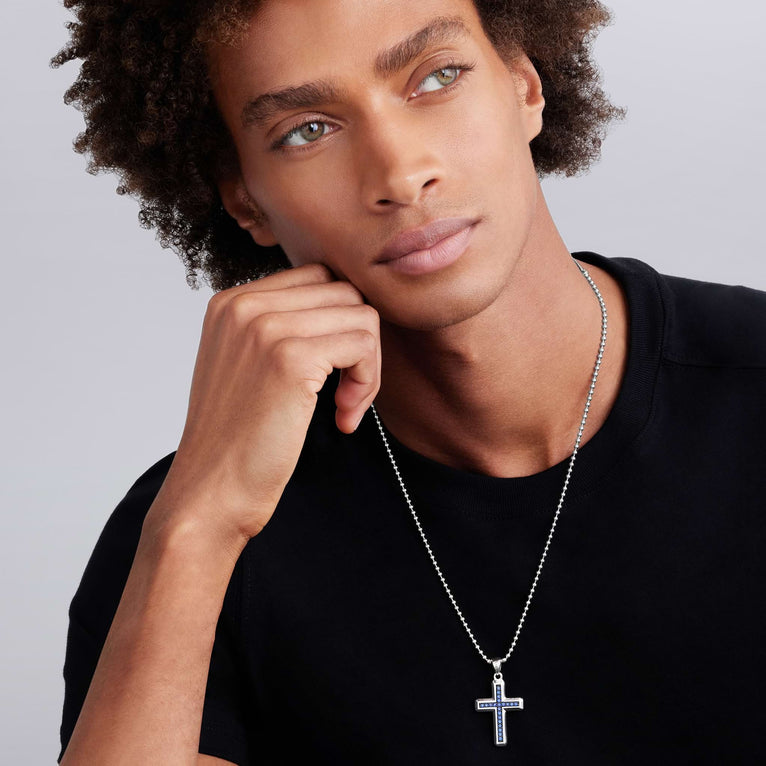 Sterling silver cross necklace with sapphires.