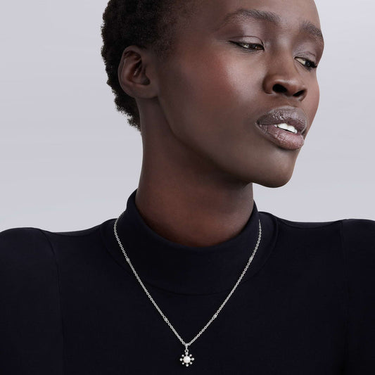 Sterling silver necklace with white pearl pendant.