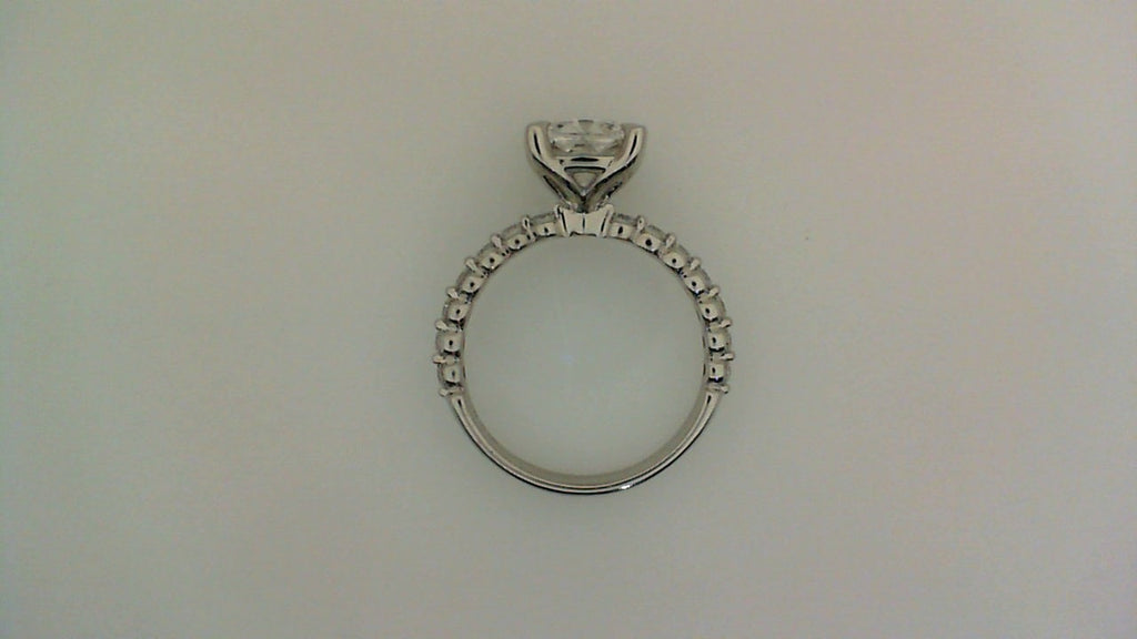 Cushion diamond ring with side stones.