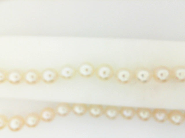 Freshwater pearl necklace on white gold strand.