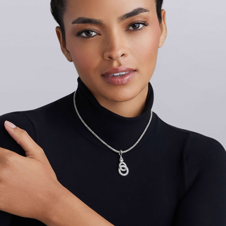 Sterling silver necklace with diamond pendant.