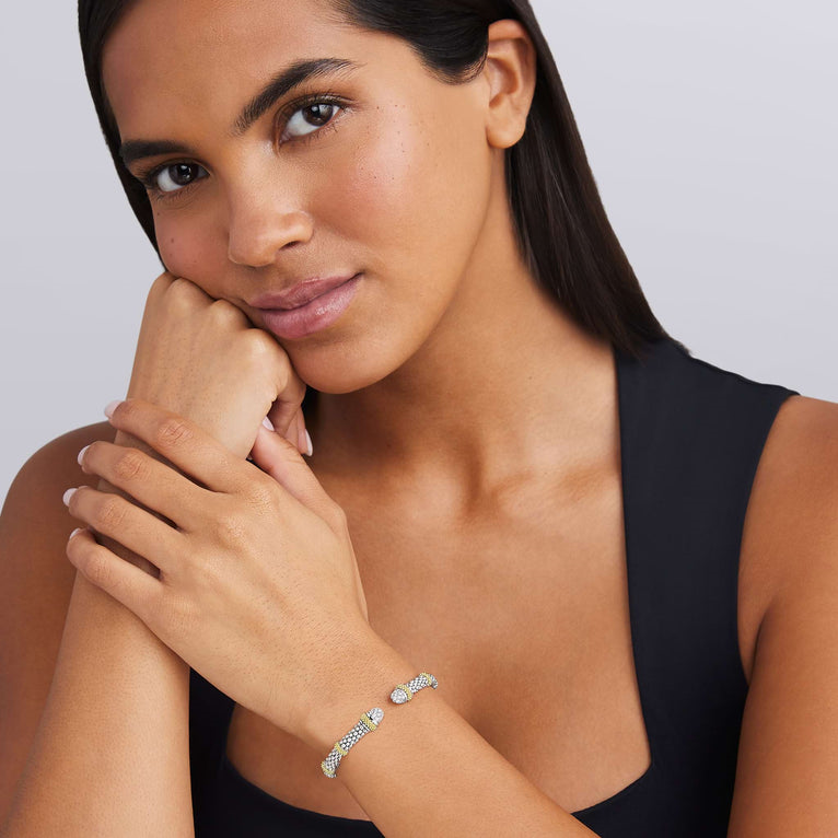 Sterling silver cuff with round diamonds.