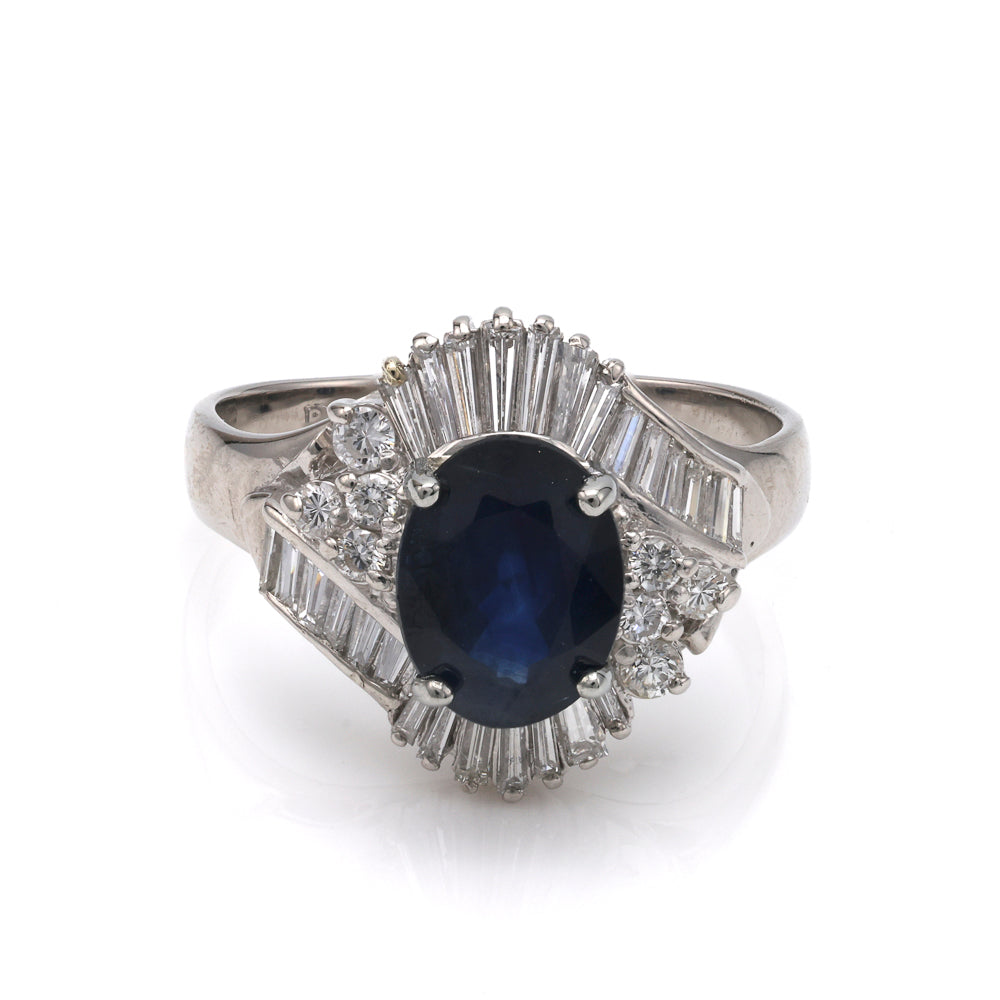 Oval sapphire ring with baguette diamonds.