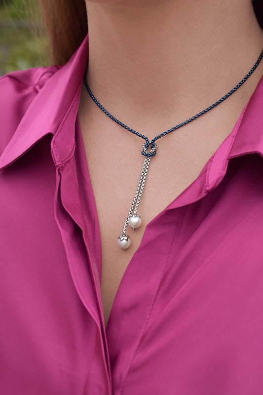 Stainless steel lariat necklace with pearls.