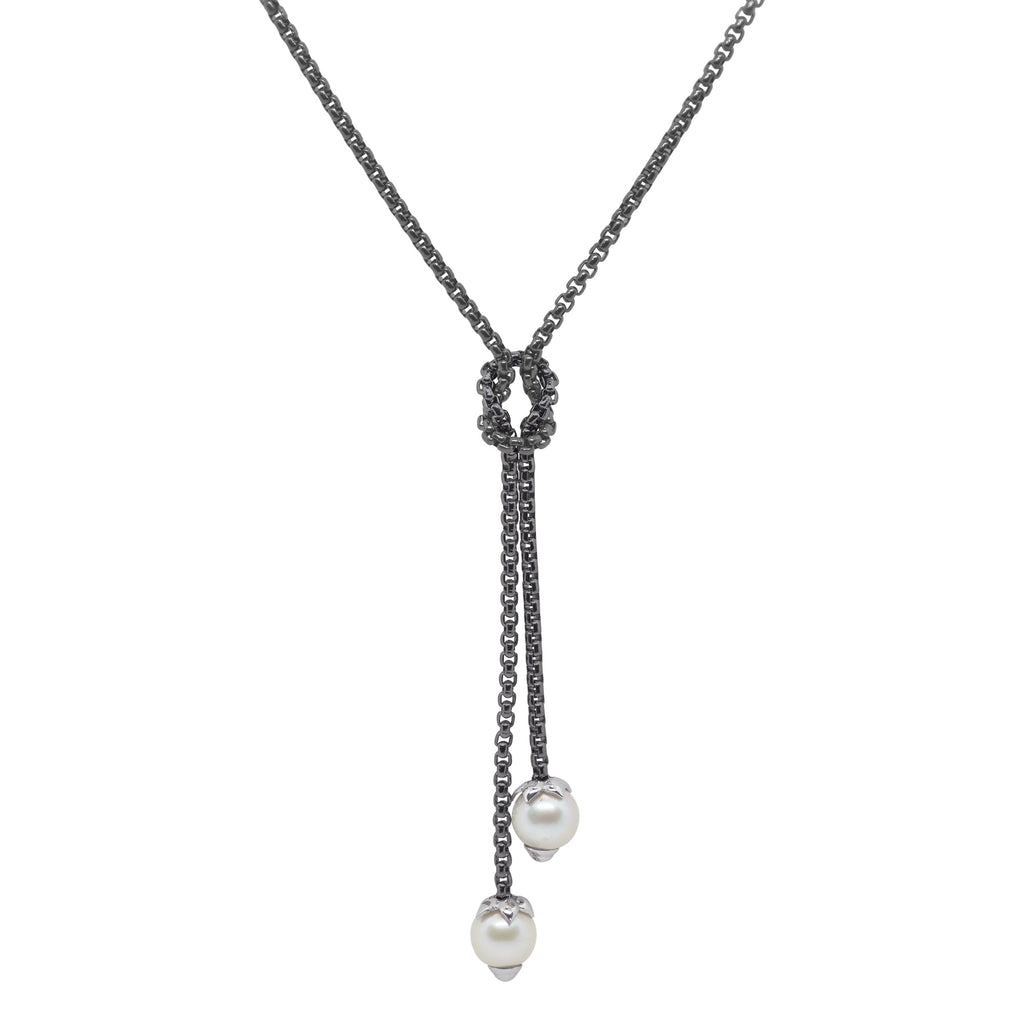 Black lariat necklace with pearl accents.