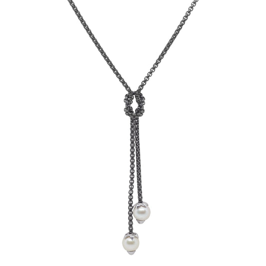 Black lariat necklace with pearl accents.