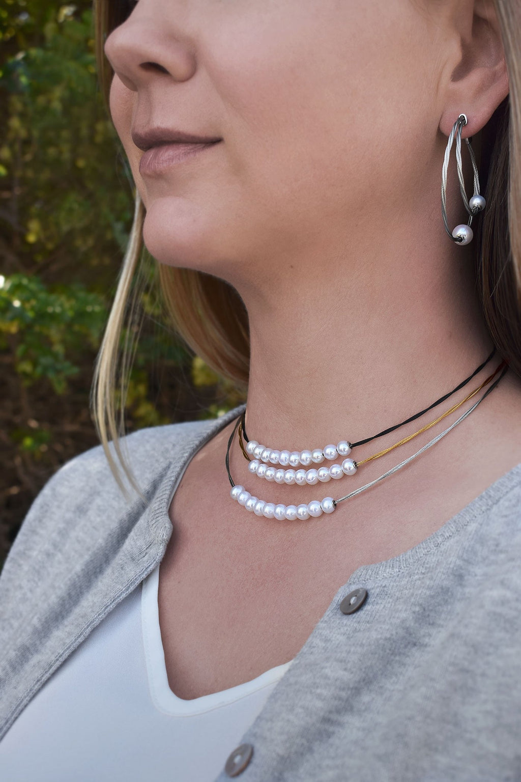 Freshwater pearl choker with stainless steel strands.