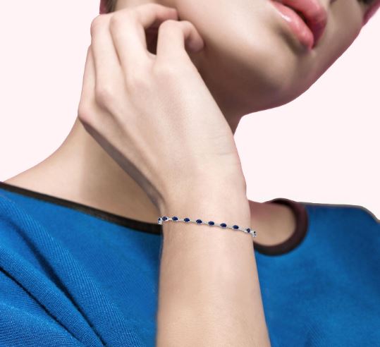 Oval sapphire and diamond station bracelet.