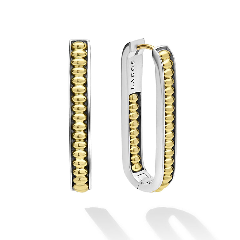Sterling silver oval hoops with gold beading.