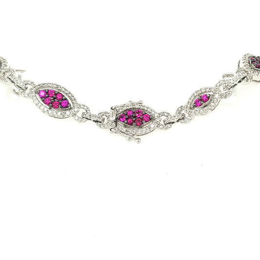 14K white gold bracelet with round rubies.