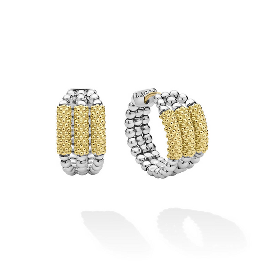 Sterling silver huggie earrings with gold beads.