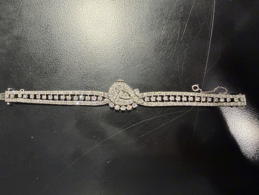 Platinum ladies watch with diamond accents.