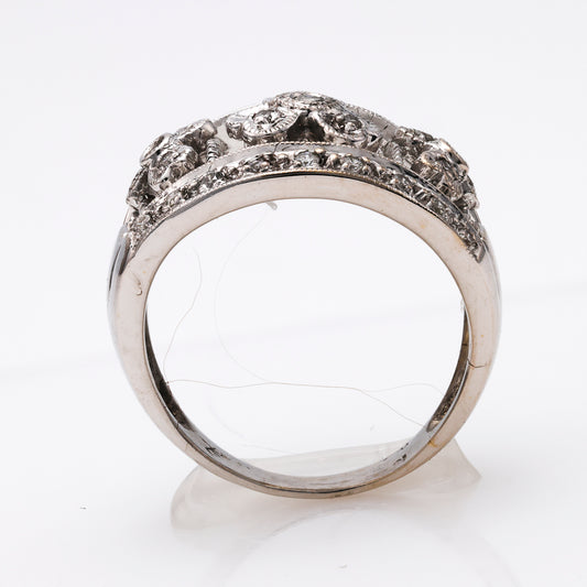 18K white gold ring with intricate diamond design.