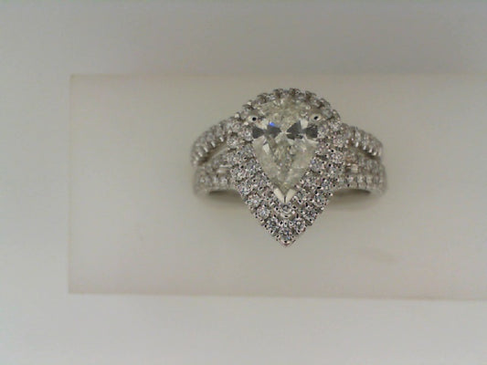 Pear-shaped diamond halo wedding set.