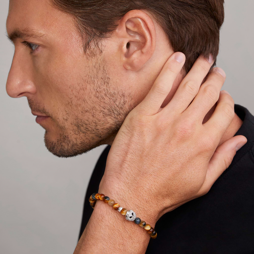 Sterling silver bracelet with tiger eye stones.