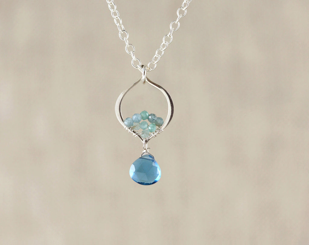 Sterling silver necklace with blue quartz pendant.