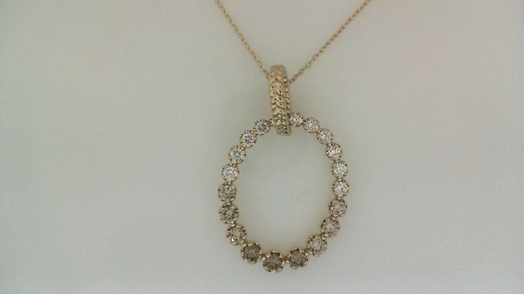 Oval diamond pendant in yellow gold necklace.