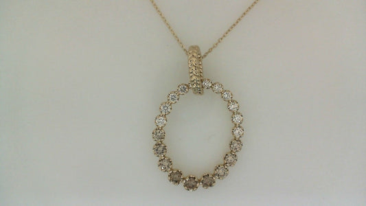 Oval diamond pendant in yellow gold necklace.