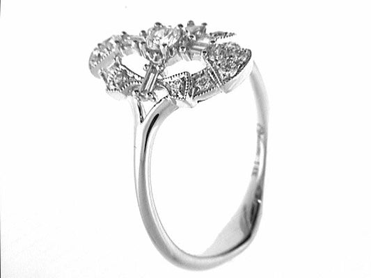 Vintage diamond ring with intricate design.