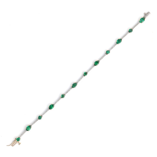 Emerald and diamond alternating link bracelet.
