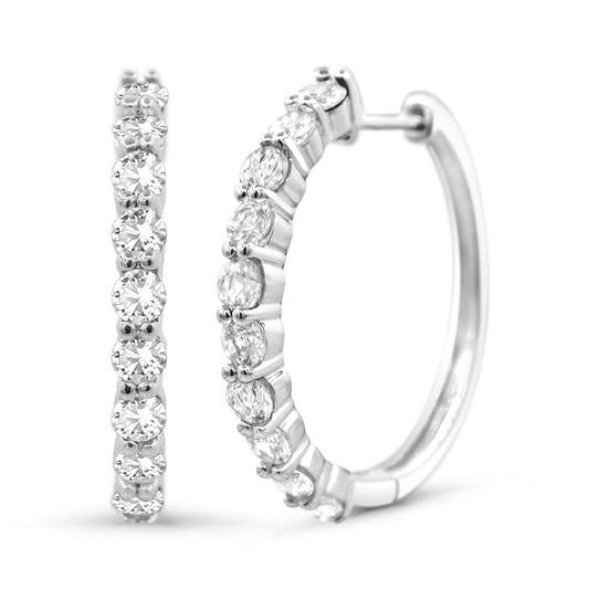 Sterling silver hoops with white sapphires.