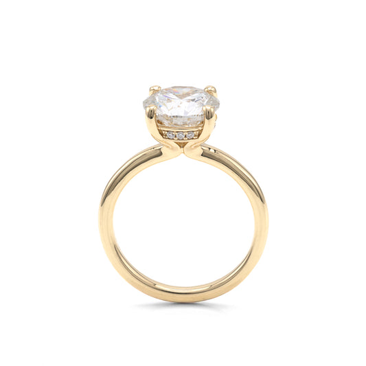 Yellow gold solitaire ring with round diamond.