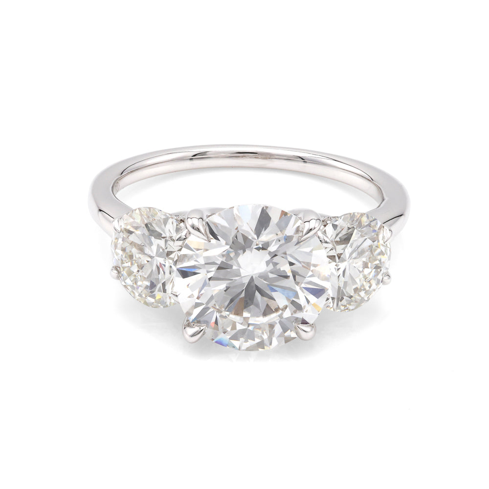 Three-stone white gold diamond engagement ring.
