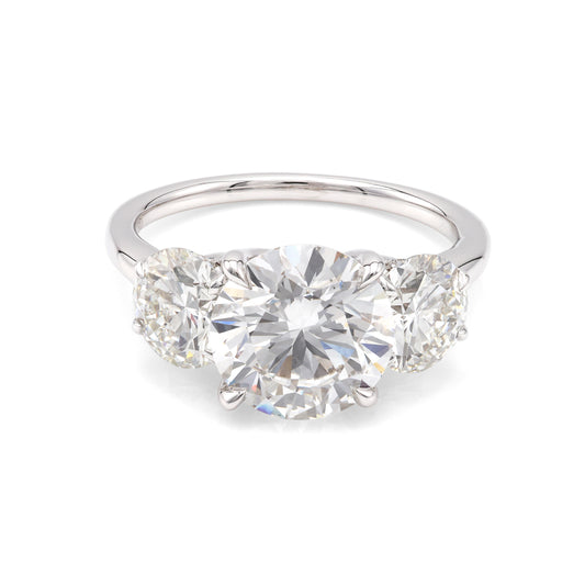 Three-stone white gold diamond engagement ring.