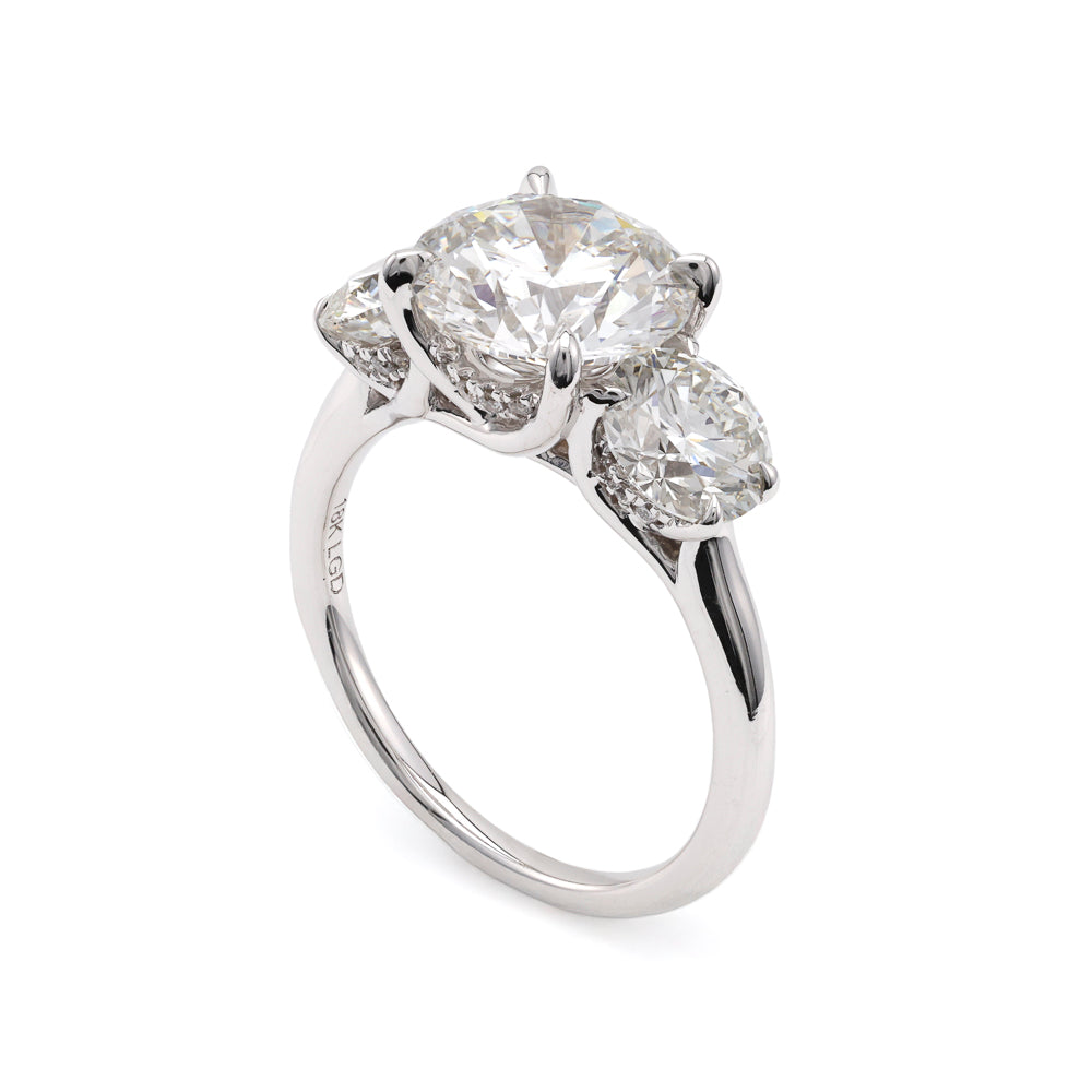 Three-stone white gold diamond engagement ring.