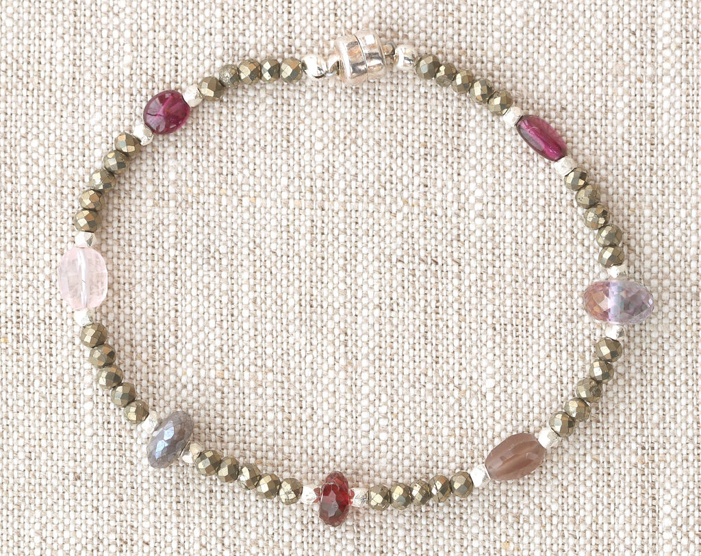 Sterling silver bracelet with garnet and pyrite.