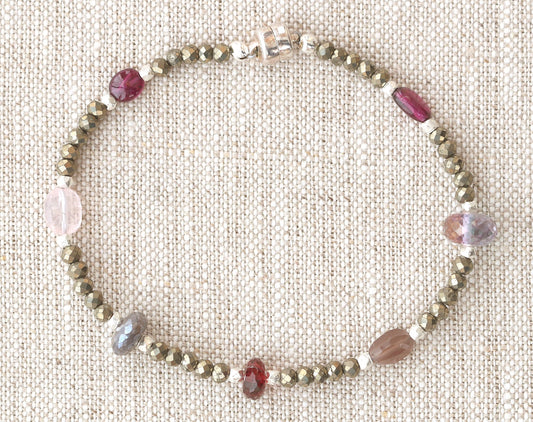 Sterling silver bracelet with garnet and pyrite.