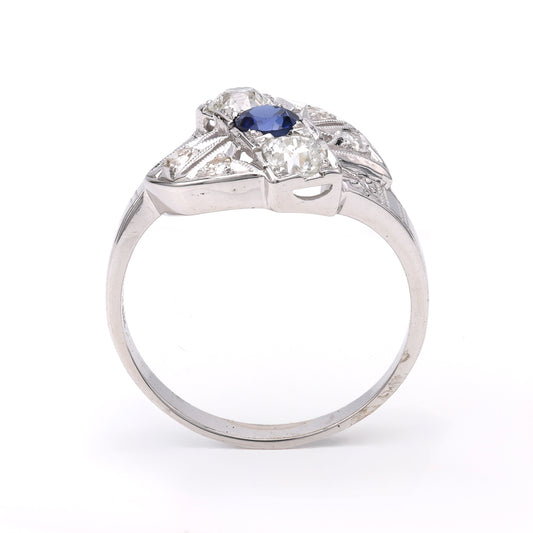 14K white gold ring with sapphire centerpiece.