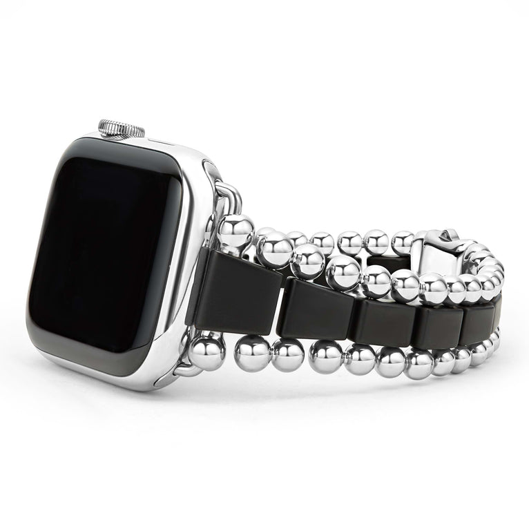 Black ceramic watch band with silver accents.