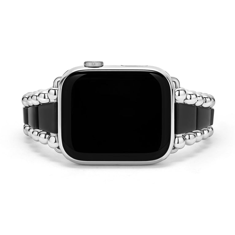 Black ceramic watch band with silver accents.
