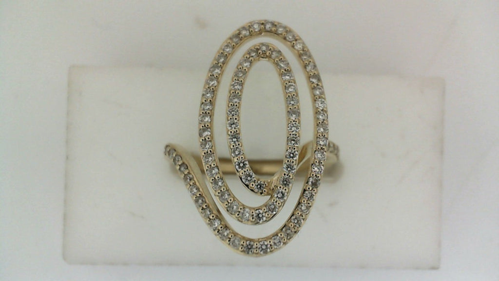 Yellow gold ring with swirling diamond design.