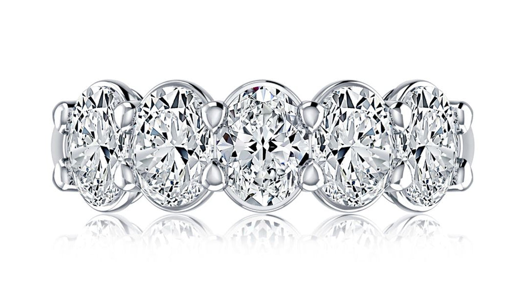 Five oval diamonds on white gold band.