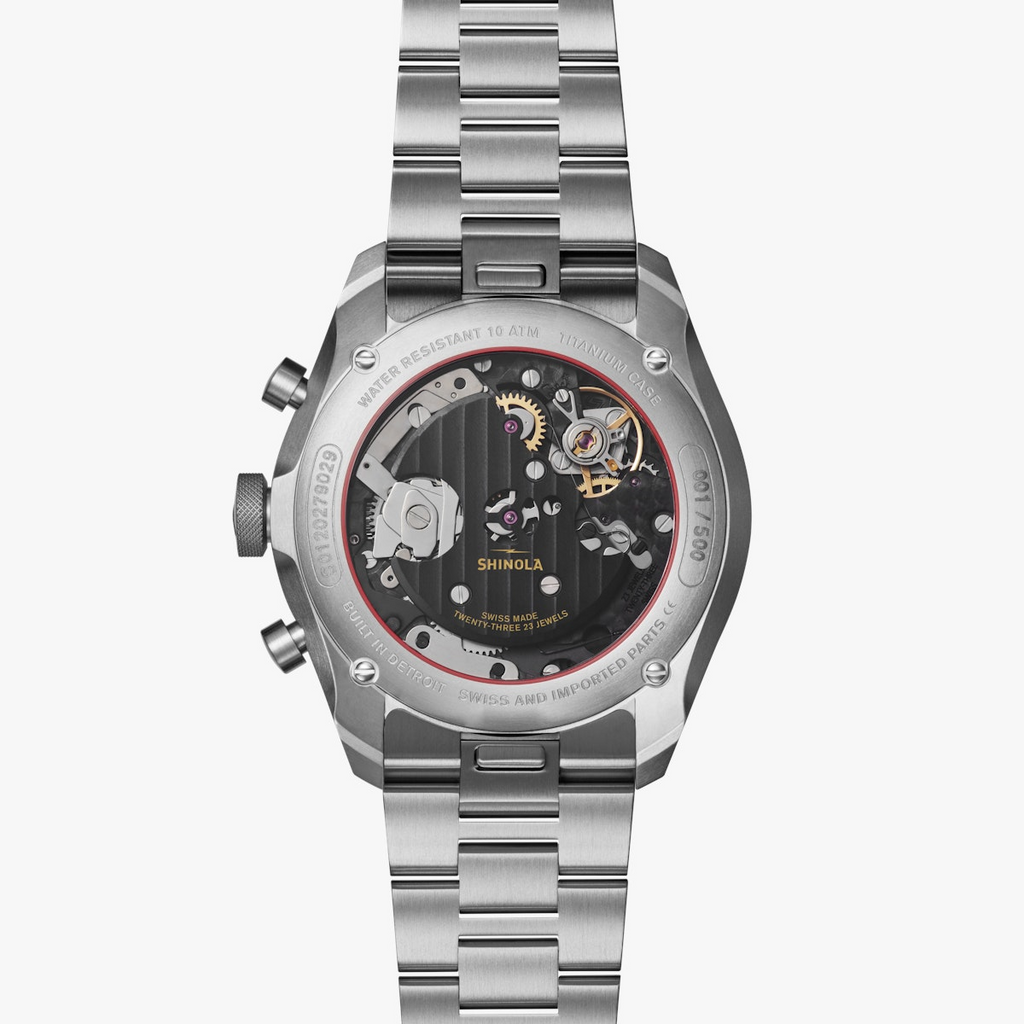 Titanium watch with visible automatic movement.