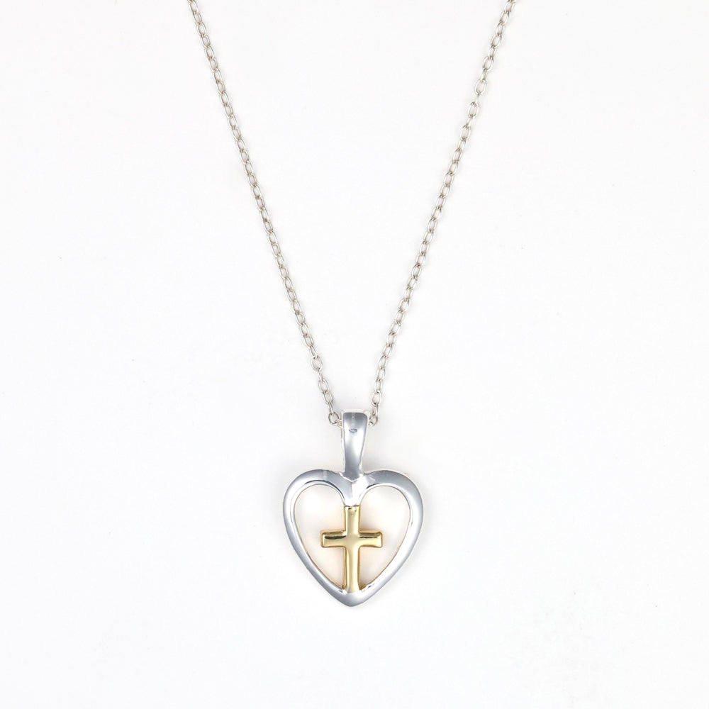 Sterling silver heart necklace with gold cross.