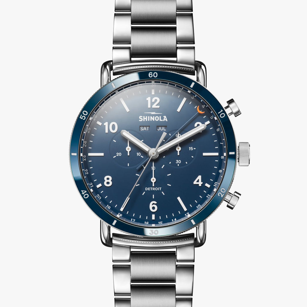 Stainless steel watch with blue dial.