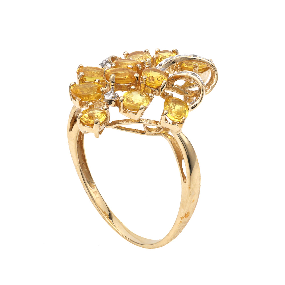 Yellow gold ring with citrines and diamonds.