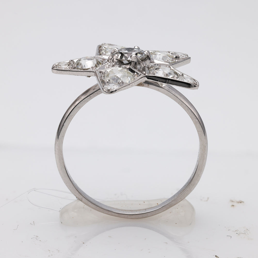 Platinum ring with star-shaped diamond setting.