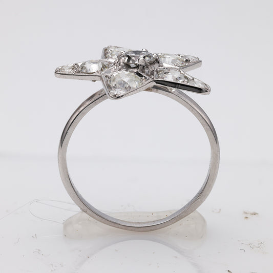 Platinum ring with star-shaped diamond setting.