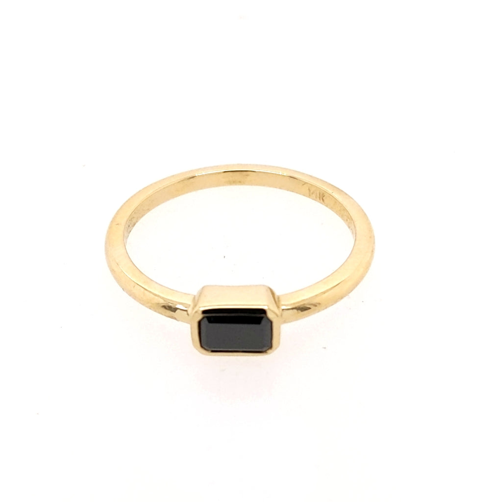 Yellow gold ring with black emerald diamond.