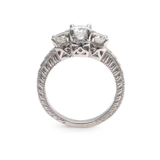 Three Stone Natural Diamond Complete Engagement Ring in 14 Karat White with 1 Round Diamond, Color: G/H, Clarity: I1, totaling 0.69ctw