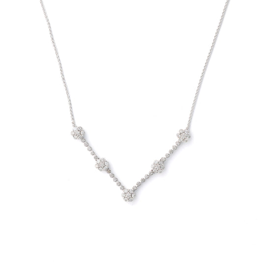 Diamond necklace with clustered round diamonds.